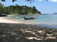 One way to reach Paradise Beach is by longtail boat